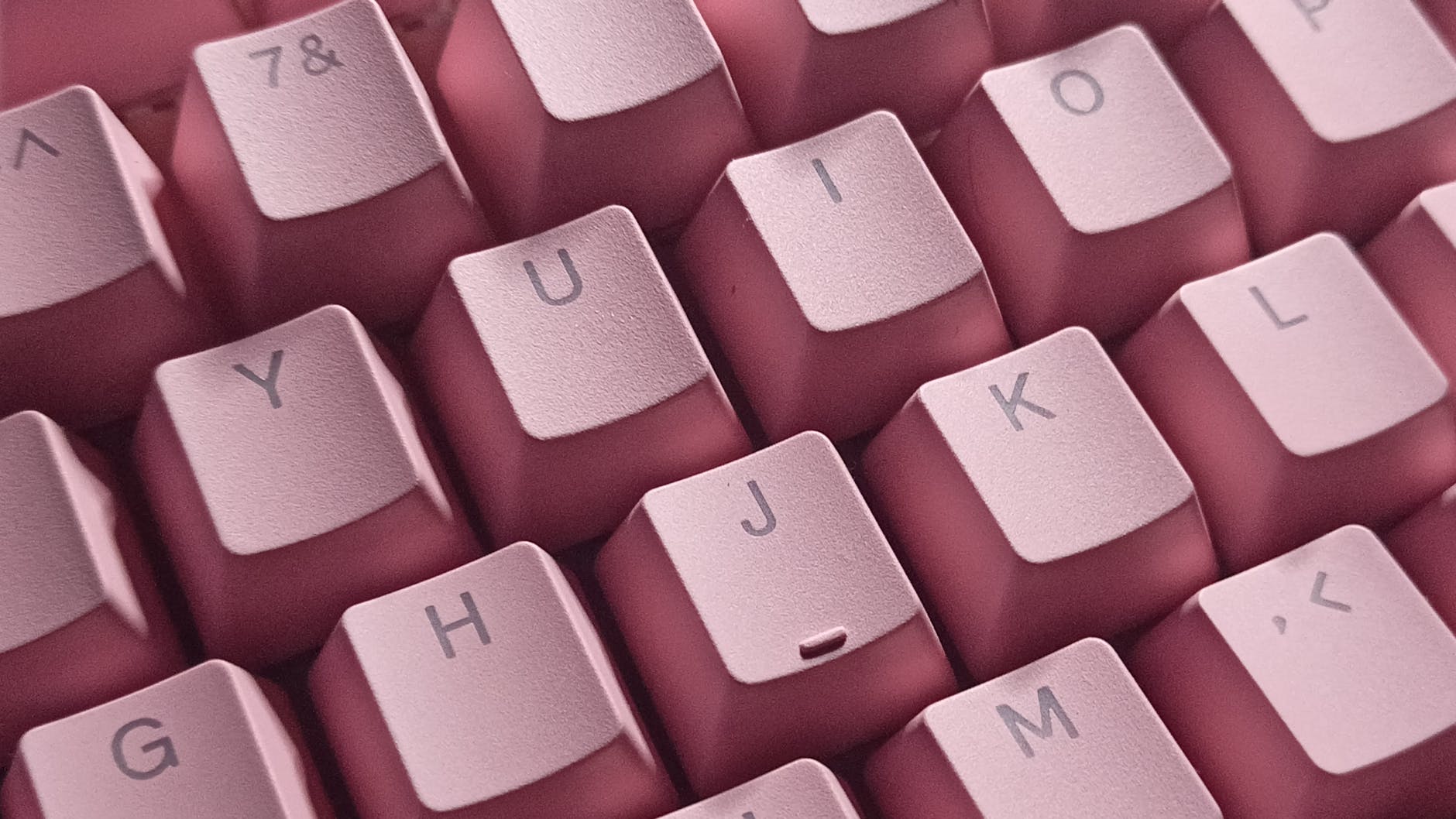 Photo of a pink keyboard by riko on Pexels.co